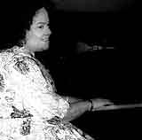 Photograph of Ernie Mae Miller playing the piano
